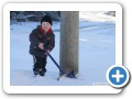 Shovelling the lawn.