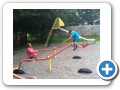 On the playground with Nana.