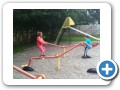 On the playground with Nana.